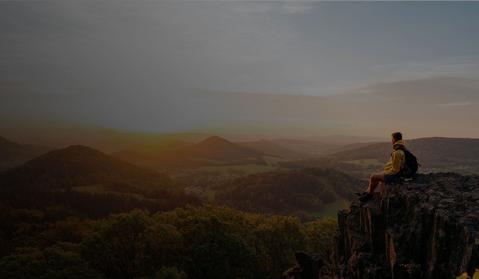 Hiker sitting on a cliff